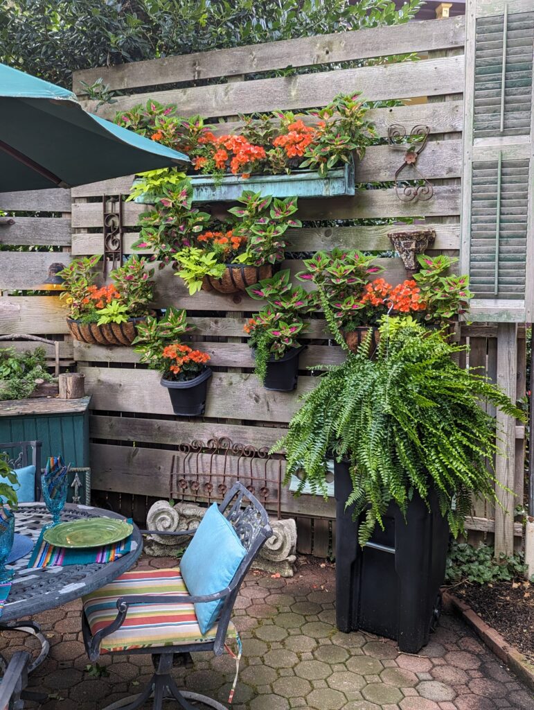 Wooden wall with hanging pots that are eye level